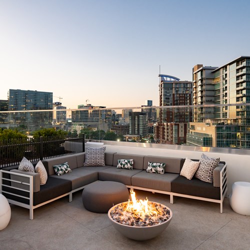rooftop pool lounge firepit and seating with city view